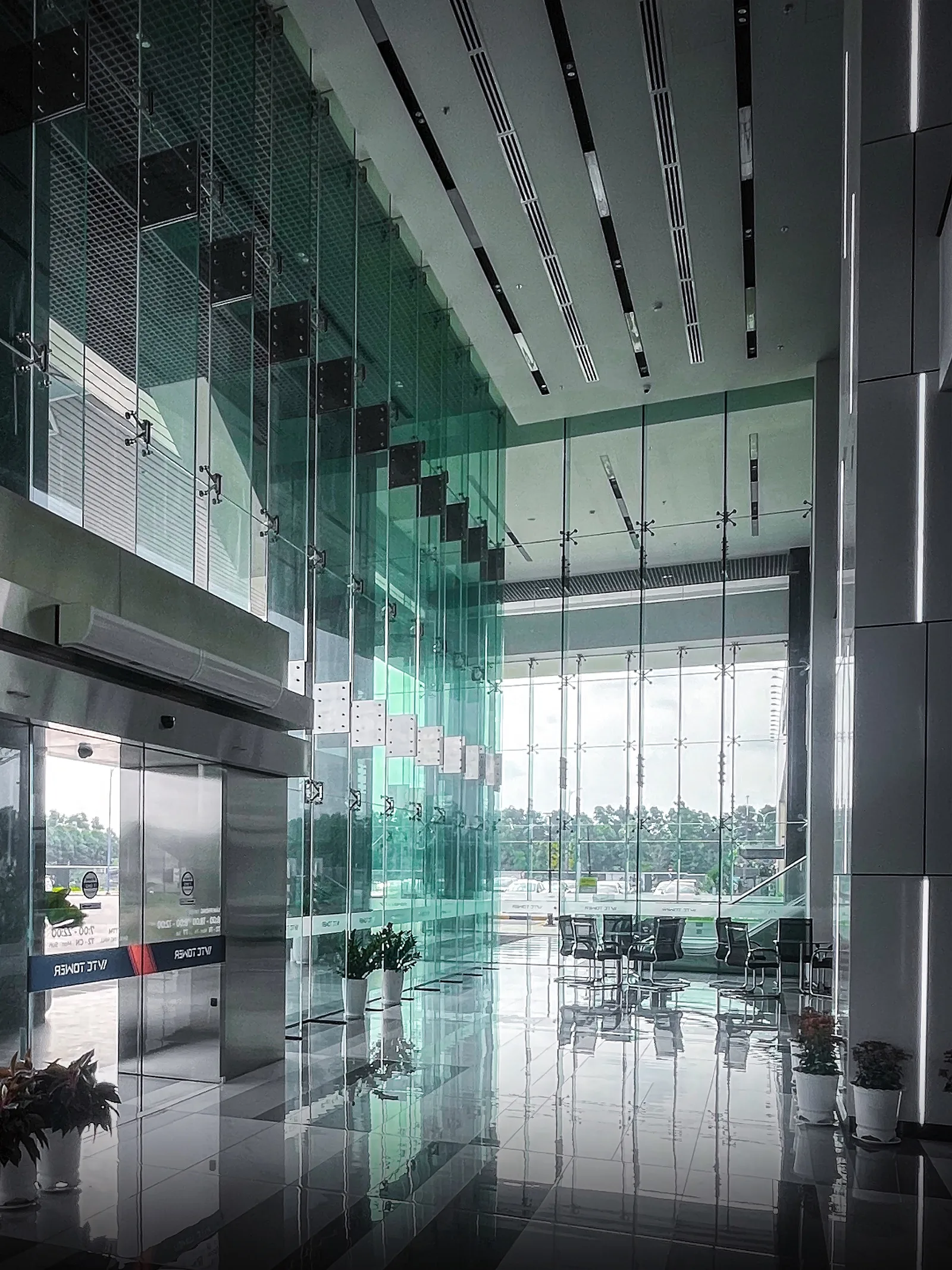 A pristine, light-filled modern office lobby.